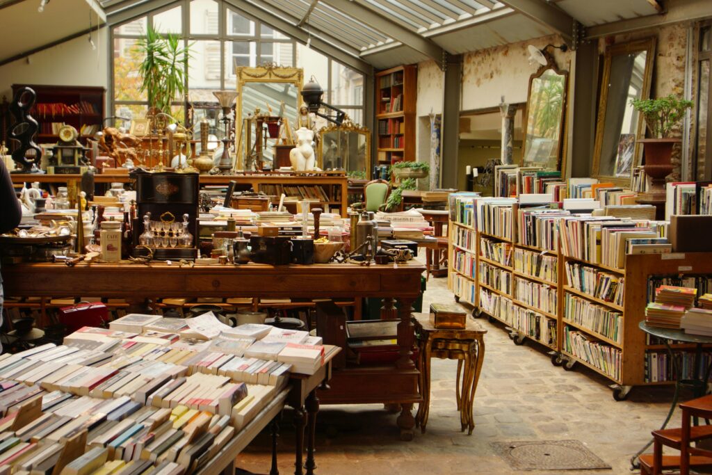 Explore this cozy Parisian vintage bookshop overflowing with books and antiques. Book shop.