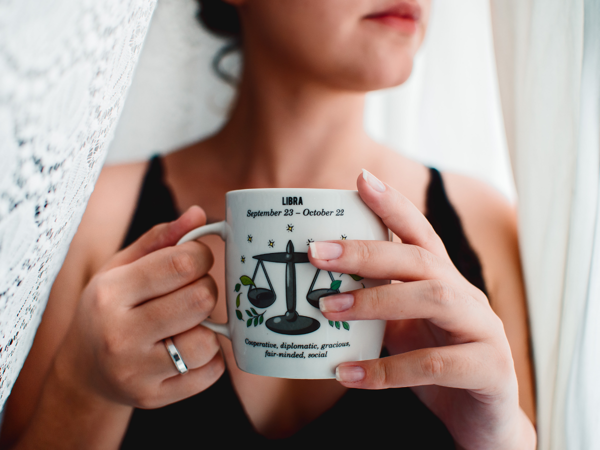 Libra woman, libra zodiac sign, cup, woman holding cup