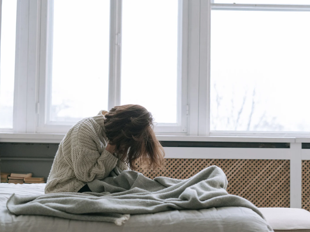 woman sad, bed, unable to sleep, woman and menopause